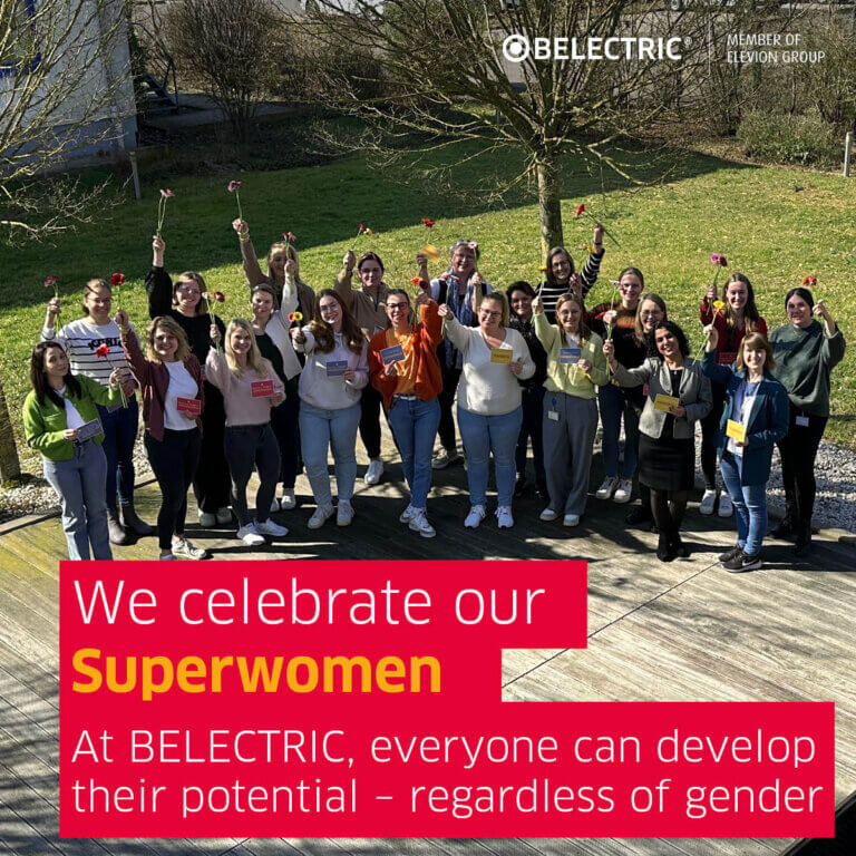 Female employees each holding up a flower, with the slogan ‘We celebrate our superwomen’ underneath.