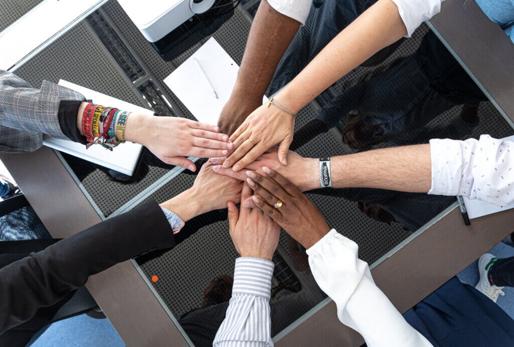 A variety of different hands together