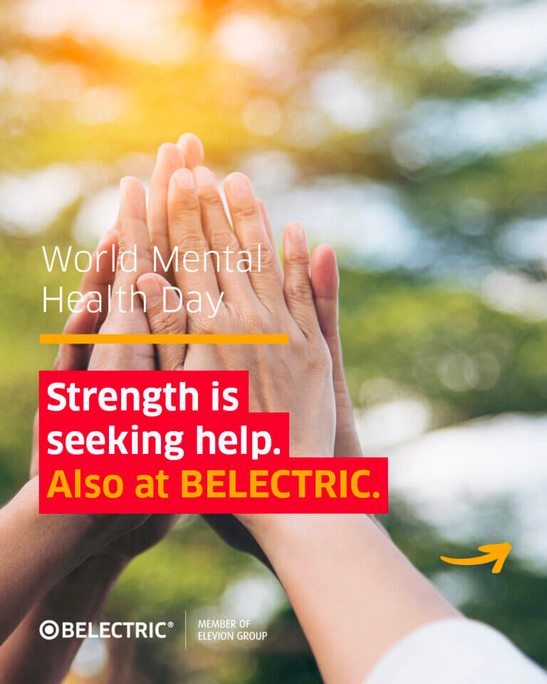 Focus on several hands holding together with the slogan: World Mental Health Day - Strength is seeking help. Also at BELECTRIC.